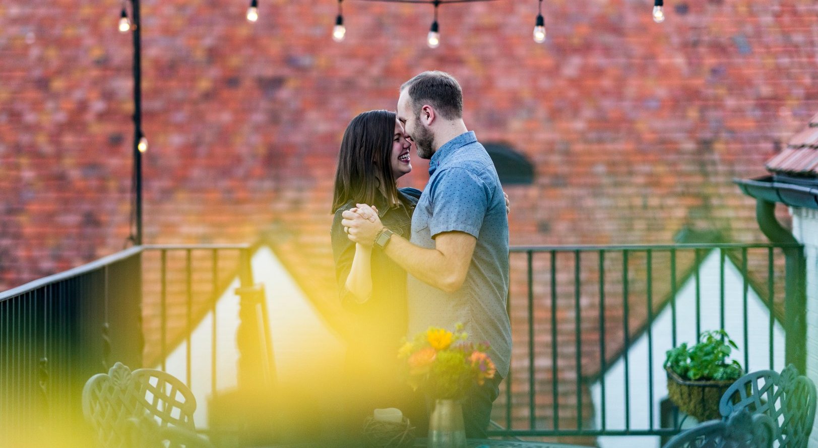 married couple dancing on patio at a winshape marriage retreat