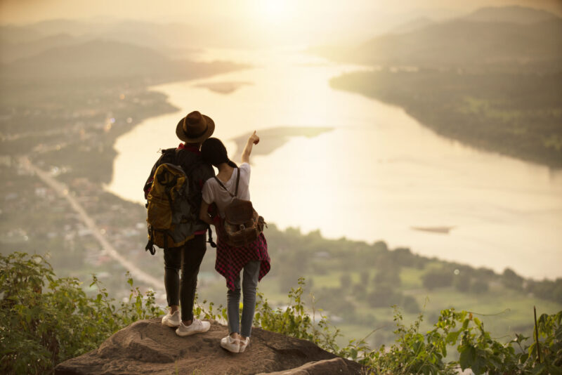 Married couple looking out over a landscape together dreaming about a vision for their marriage