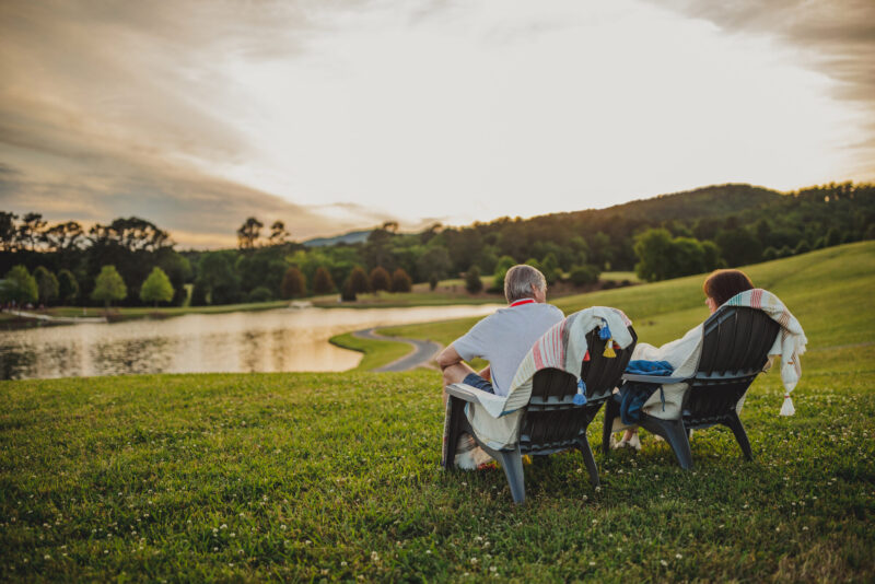 couple sitting overlooking lake at winshape retreat