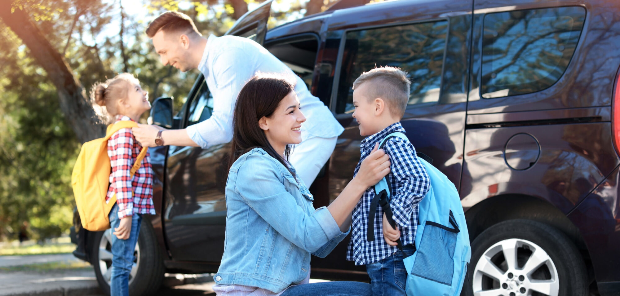 Married couple with children preparing for the upcoming school year and how to be successful