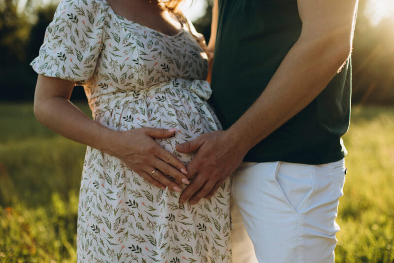 A married couple expecting their first child and having conversations about preparing for a baby