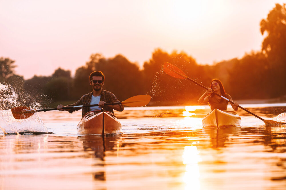 Young couple canoeing, one of the abc date challenges on their alphabet dating list