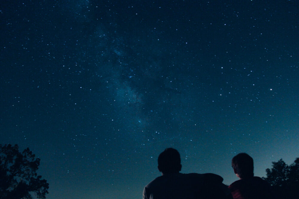 Married couple stargazing, one of the abc date challenges on their alphabet dating list