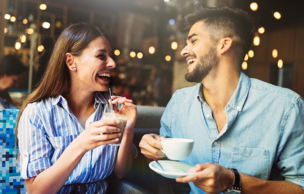 Young married couple on a coffee date during the fall time