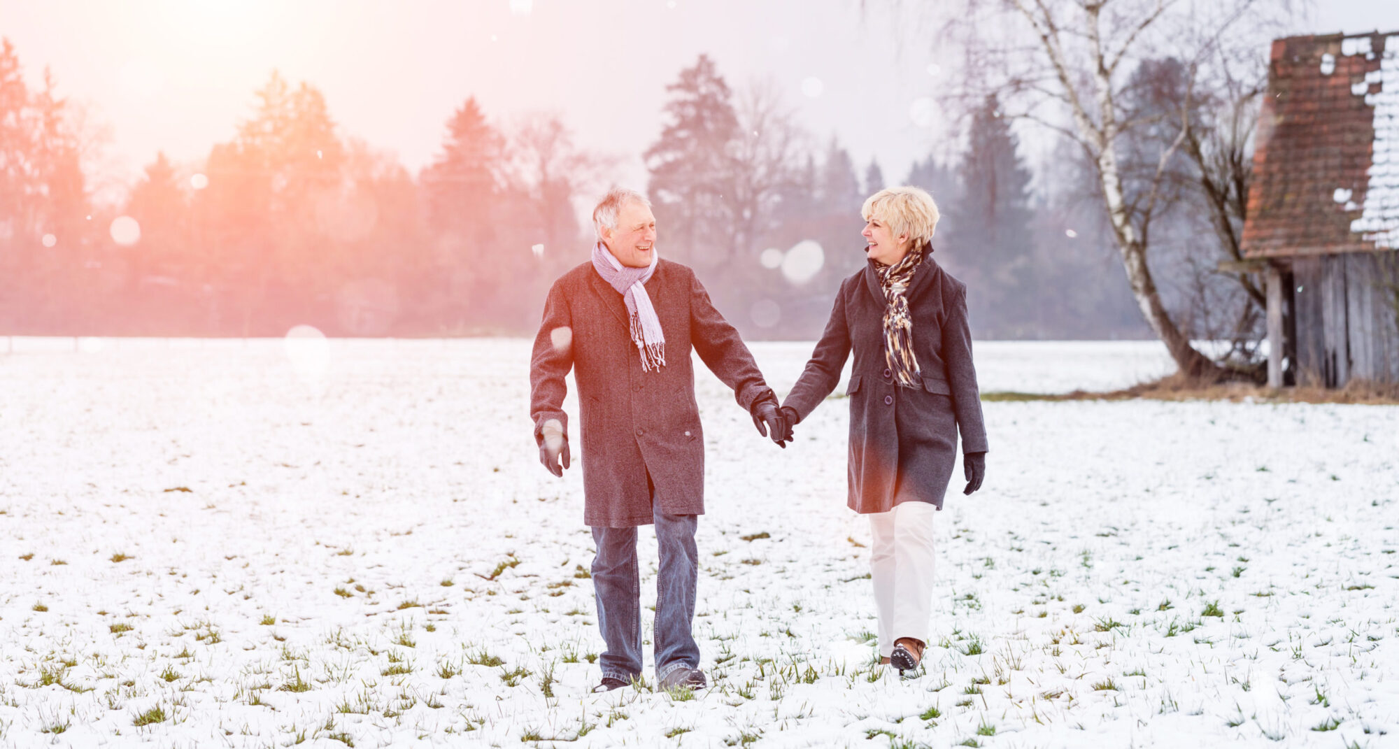 Older married couple leaning on each other to combat holiday loneliness