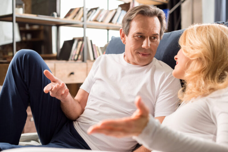 Middle aged married couple searching for what to talk about with your spouse to reconnect and using some of our advice for conversation prompts