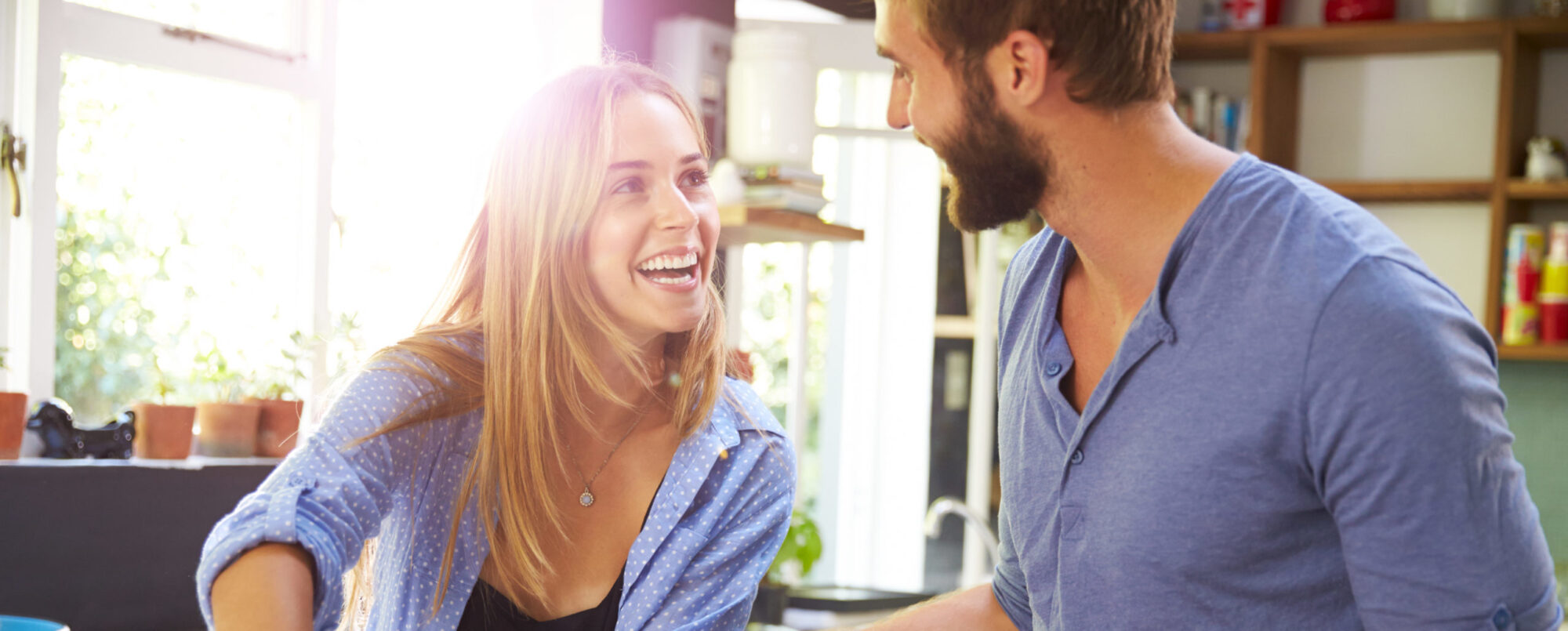 Young married couple choosing to partake in a unique date idea by making homemade pizza together