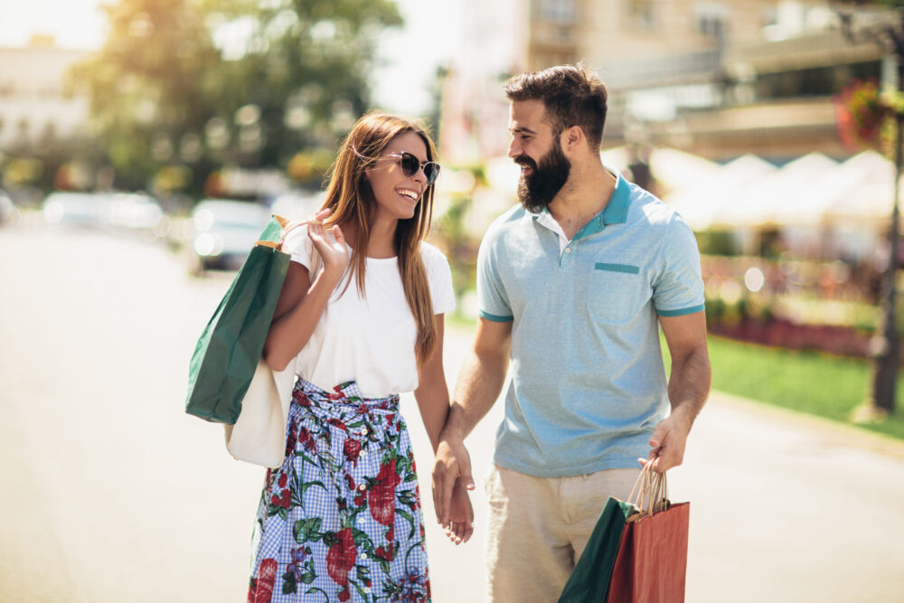 Young married couple enjoying the afternoon shopping, one of the many things to do when deciding what to do in rome georgia