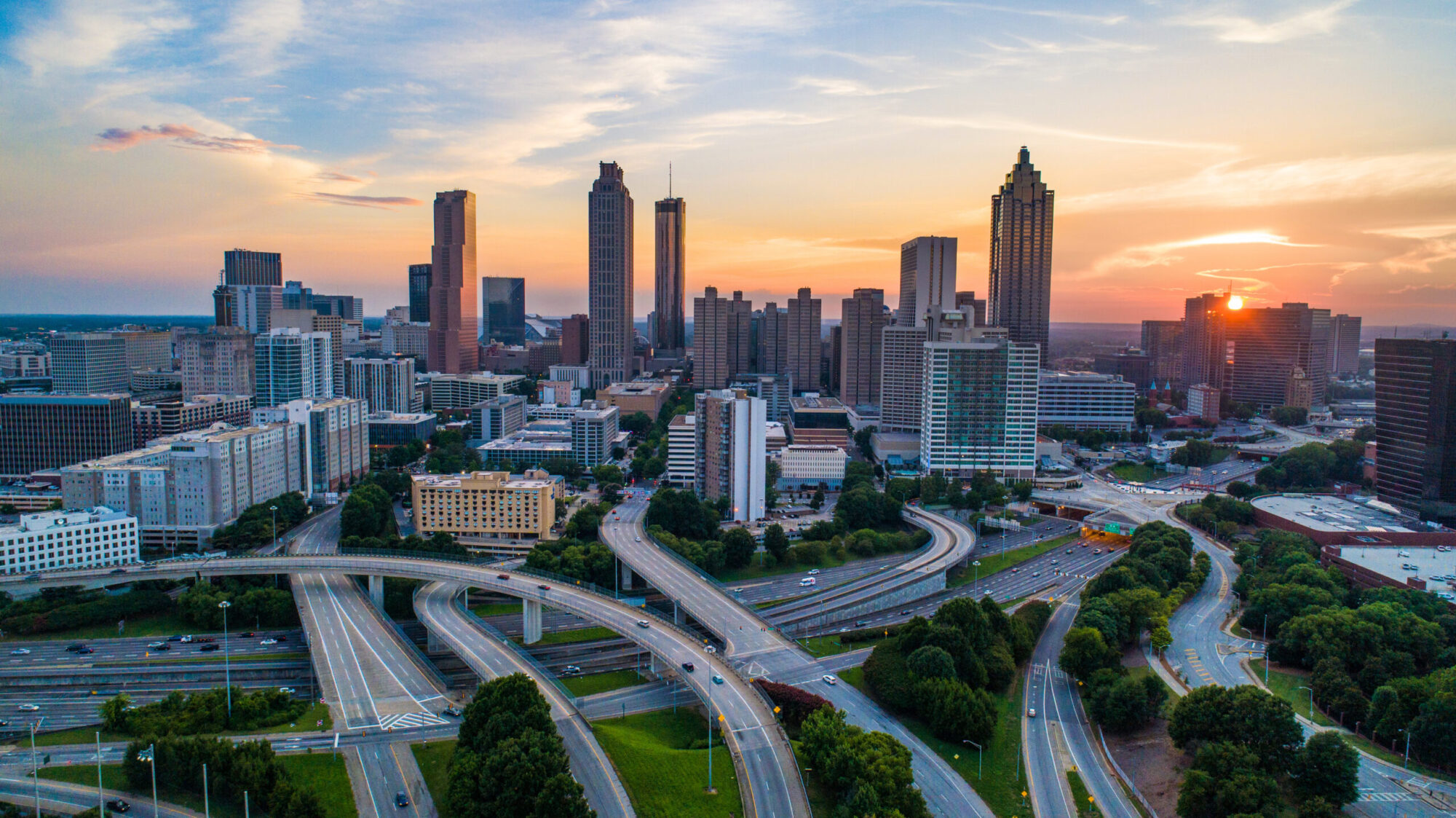 an image of the atlanta, georgia skyline at sunset