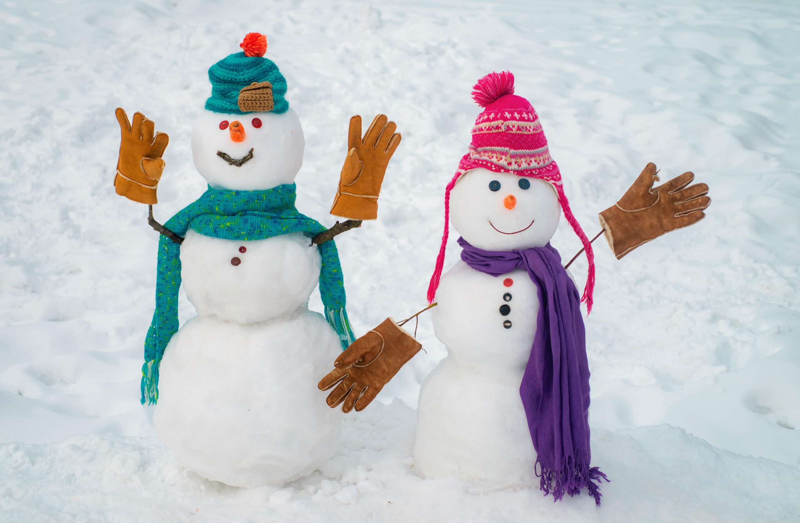 Boy and girl snowmen aka a snow couple, building snowmen is one of our winter date ideas