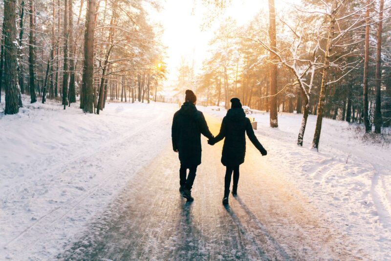 Married going on a winter walk together, participating in one of our winter date ideas