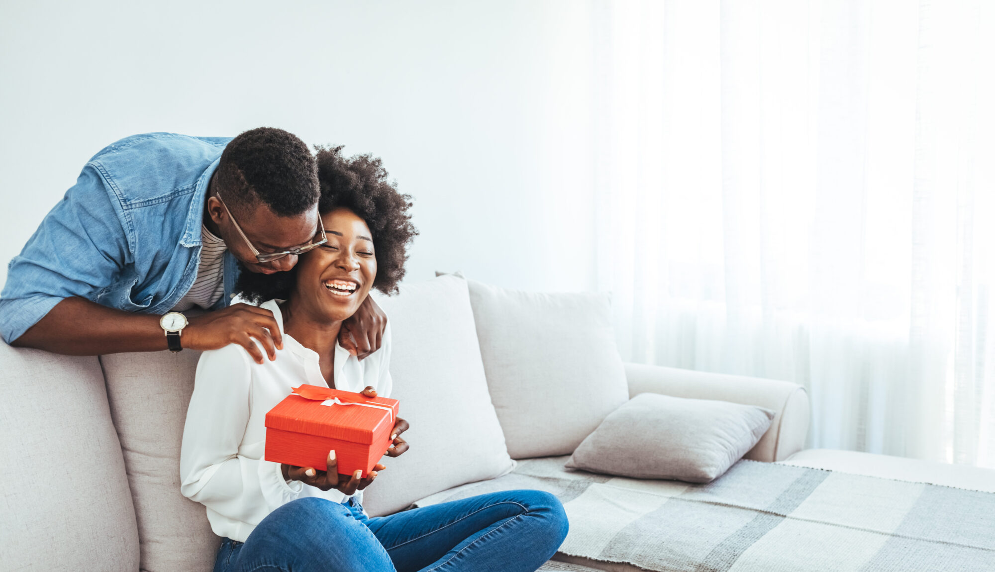 Young married couple exchanging DIY Valentine's Day baskets on February 14