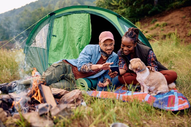 younger married couple camping, one of their bucket list dates, one of our 80 date ideas for couples, unique date ideas