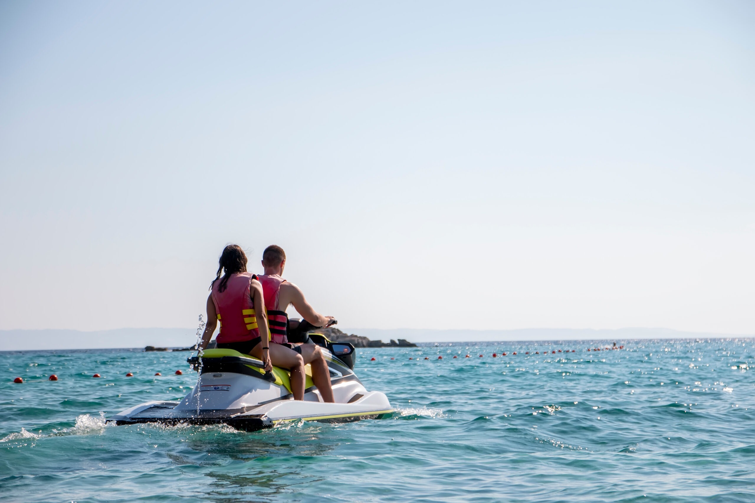 young married couple jet skiing a fun date idea