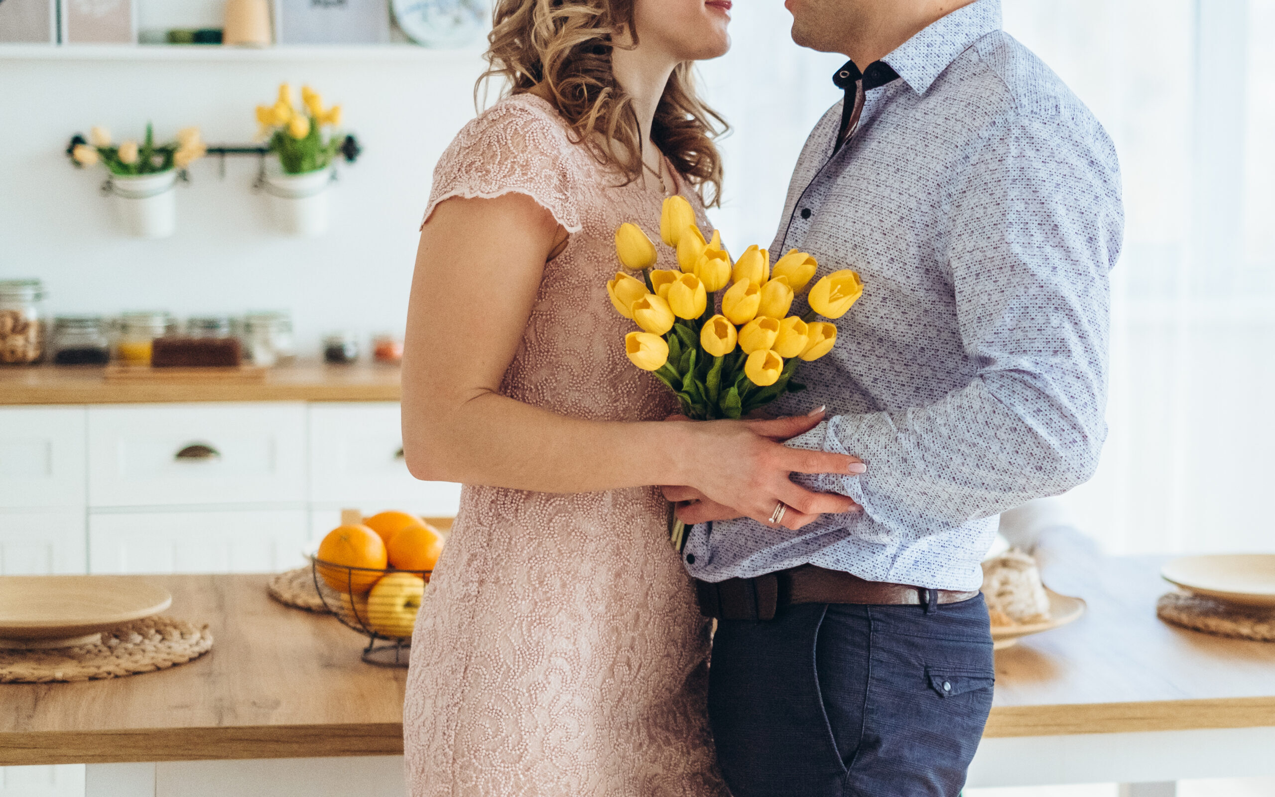 A young married couples exchanges Easter gifts; they used our list of Easter basket ideas for adults