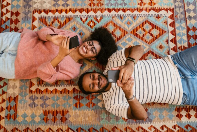 Young couple using free would you rather questions for couples to have good conversation with each other