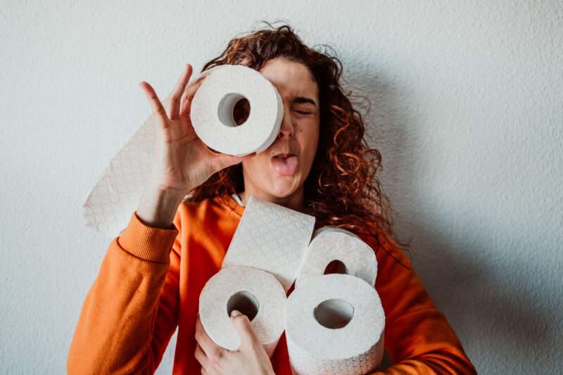 Young wife using one of our best April Fools' Day pranks to make her husband laugh on April 1